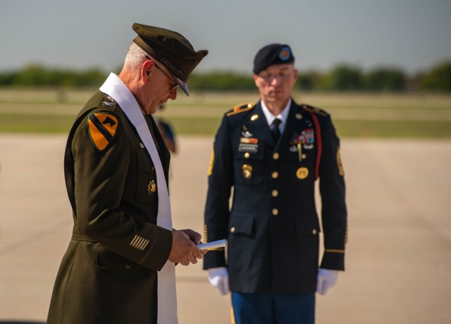 Chaplain (Col.) Rajmund Kopec, a senior chaplain assigned to U.S. Army Forces Command, says a prayer over Chaplain (Capt.) Emil J. Kapaun&#39;s casket on the tarmac of the Wichita Dwight Eisenhower International Airport, Kan., Sept. 25, 2021. In May, the Defense POW/MIA Accounting Agency fully identified Kapaun&#39;s remains, who previously served with the 3rd Battalion, 8th Cavalry Regiment, 1st Cavalry Division during the Korean War. He was posthumously awarded the Medal of Honor in 2013 for his actions overseas.
