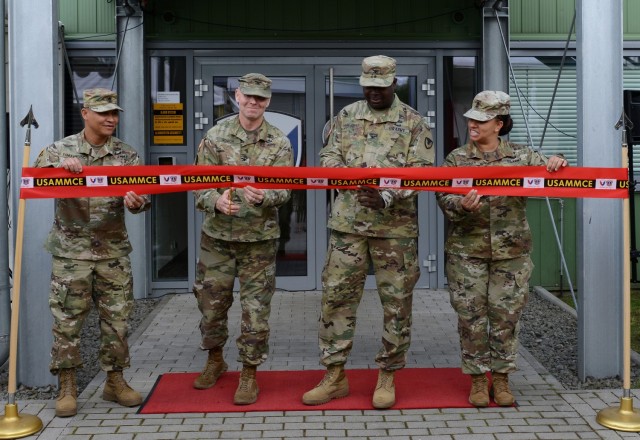 From left to right: U.S. Army Sgt. Maj. Francis Famularcano, Col. Shane Roach, commander, both with U.S. Army Medical  Materiel Center-Europe, Col. Anthony Nesbitt, commander, and Sgt. Maj. Monnet Bushner both with Army Medical Logistics Command cut the ribbon to the USAMMCE Kaiserslautern Army Depot on Sep. 17, 2021 at Kaiserslautern, Germany. The ceremony formalizes the move from the command’s former base in the Husterhoeh Kaserne in Pirmasens, Germany where it has called home since 1975. USAMMCE provides theater level Class VIII medical supplies for U.S. Army Europe & Africa units. (U.S. Army Photo by Elisabeth Paqué).