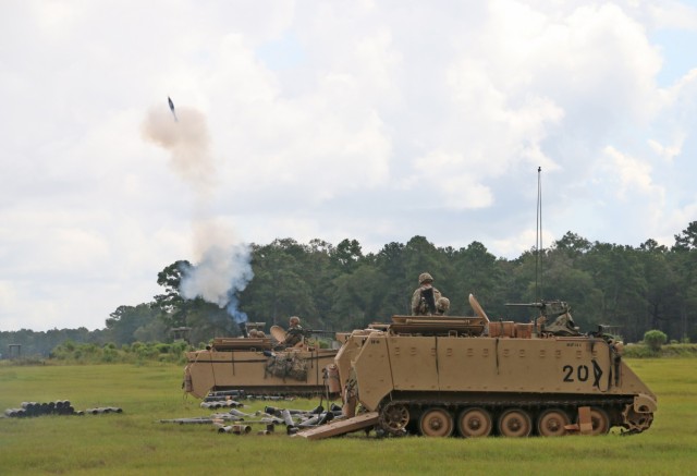 Soldiers assigned to the mortar section of 3rd Battalion, 67th Armored Regiment, 2nd Armored Brigade Combat Team, 3rd Infantry Division, ire a volley of 120mm rounds toward a target at OP4 on Fort Stewart, Georgia, Sept. 15, 2021. The mortar...