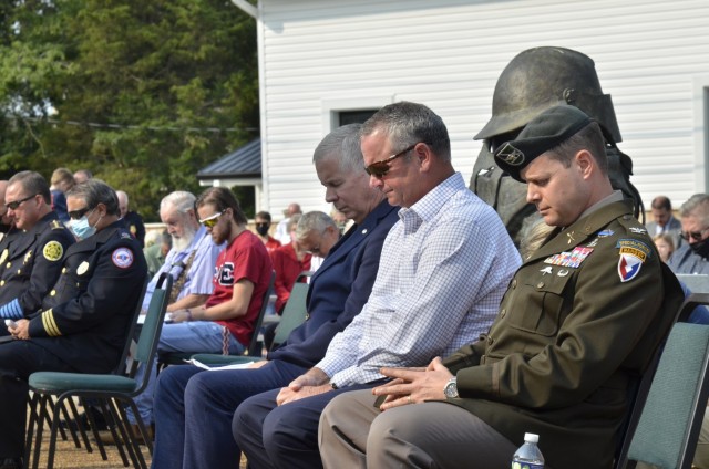 Community leaders take a moment to pray during the city of Clarksville’s 2021 9/11 Ceremony, hosted Sept. 11 at Fire Station 1. Pictured are Clarksville Mayor Joe Pitts, left, Montgomery County Mayor Jim Durrett and Col. Andrew Q. Jordan, Fort Campbell garrison commander.