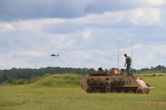 Soldiers assigned to 3rd Battalion, 67th Armored Regiment, 2nd Armored Brigade Combat Team, 3rd Infantry Division, prepare their M113 tracked vehicle for an iteration of mortar live fire exercises at Fort Stewart, Georgia, Sept. 15, 2021. The...