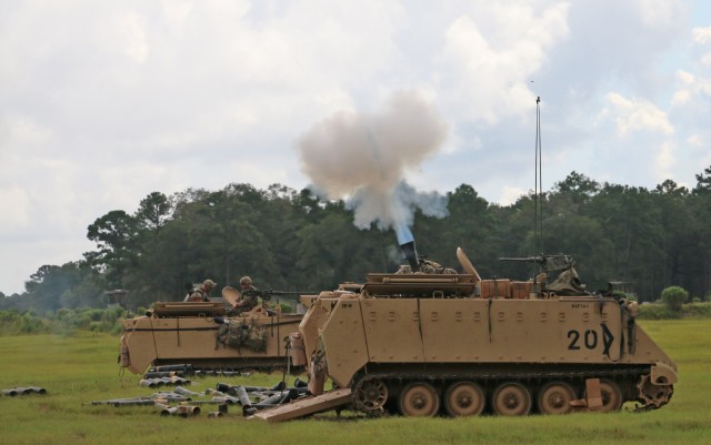 Soldiers assigned to the mortar section of 3rd Battalion, 67th Armored Regiment, 2nd Armored Brigade Combat Team, 3rd Infantry Division, fire a volley of 120mm rounds toward a target at OP4 on Fort Stewart, Georgia, Sept. 15, 2021. The mortar...