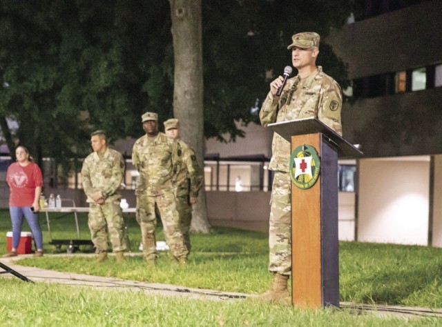 Colonel Vince Myers, commander, Blanchfield Army Community Hospital, speaks to the crowd Sept. 16 at the annual Light Up the Night ceremony in the hospital parking lot. The nighttime event included hearing guest speakers from Team Unbroken, share their stories of personal loss through suicide and to offer words of support, a vigil and candlelight walk along the BACH fitness trail.