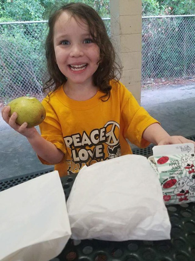 Magdylena Lopez, the daughter of an Army Soldier stationed at Hunter Army Airfield, enjoys a free lunch thanks to the Liberty County Summer Food Program June 8, 2017, in Hinesville, Ga. The Program helps provide meals to kids free of charge as part of the county’s mission to alleviate food insecurity. Families are able to find a program site at many neighborhoods, parks, churches, and recreation centers throughout the county.