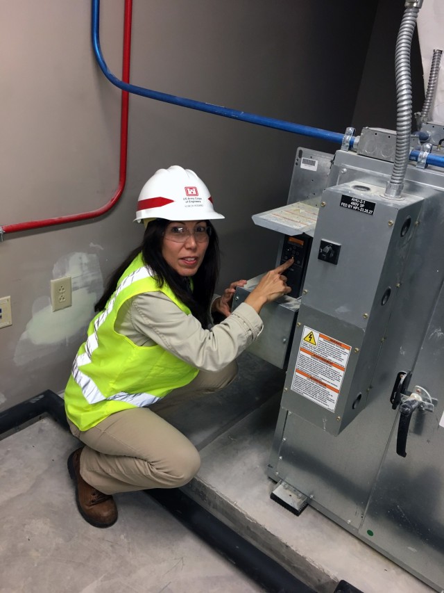 Kebeck Marielle Rosario Perez, a Service Project Manager and Contracting Officer Representative for the 81st Readiness Division’s Facilities Investment Services contract, works on HVAC commissioning during a barrack building renovation at Ft. Jackson, S.C. in 2018.