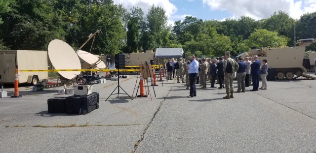 Leaders from the “Spartan Brigade,” 2nd Armored Brigade Combat Team, 3rd Infantry Division, 3rd ID headquarters, Network-Cross Functional Team and Program Executive Office Command, Control, Communications-Tactical compare the new versus the old satellites transportable terminals at a distinguished visitors day for the Army’s high-profile network communication pilot effort known as ABCT On-the-Move, or OTM, at the General Dynamics facility in Taunton, Massachusetts, Sept. 21, 2021. During the demonstration, General Dynamics Mission Systems displayed three different concepts of employment that the Spartan Brigade will assess during the Army’s pilot late winter in 2022 at Fort Stewart. (U.S. Army photo by Amy Walker, PM Tactical Network, PEO C3T)