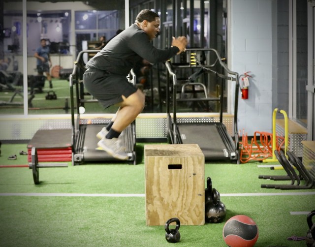 Army Reserve Sgt. Demos Moore, a chemical, biological, radiological and nuclear specialist assigned to the 377th Chemical Company, 485th Chemical Battalion, 76th Operational Response Command, gives his legs a workout by repeatedly jumping into the air at a gym in Richmond, Virginia, February 18. Moore, who once struggled with being overweight and out of shape has dedicated himself to physical fitness, losing more than forty-pounds in the past four months. (Official U.S. Army Reserve photo by Sgt. 1st Class Brent C. Powell)