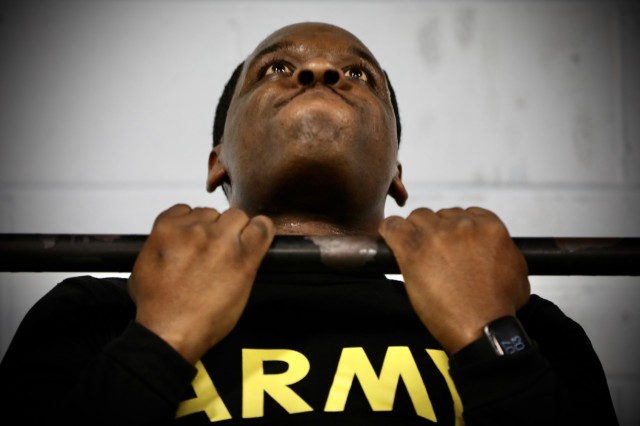 Army Reserve Sgt. Demos Moore, a chemical, biological, radiological and nuclear specialist assigned to the 377th Chemical Company, 485th Chemical Battalion, 76th Operational Response Command, performs a series of pull-ups at a gym in Richmond,...