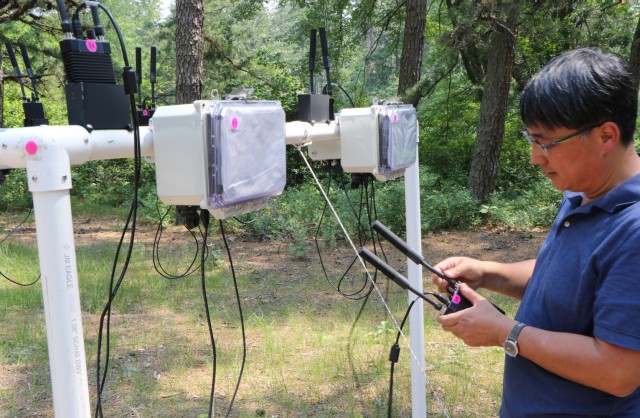Army C5ISR Center electronics engineer Dan Ku works on radios during Network Modernization Experimentation 21 on July 7, 2021, at Joint Base McGuire-Dix-Lakehurst, N.J. 