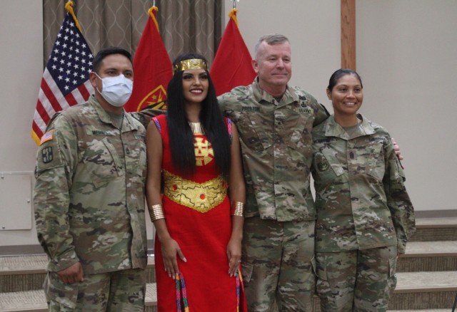 Field Artillery School commandant Brig. Gen. Andrew Preston, poses for a photo with Sgt. 1st Class Luis Merino and his wife, Tamia Merino, and 100th Brigade Support Battalion Command Sgt. Maj. Olivia McCartney at the conclusion of the Hispanic Heritage Month observance. This year’s program, “A Celebration of Hispanic Heritage and Hope” was Sept. 23, 2021 at Cache Creek Chapel on Fort Sill, Oklahoma.