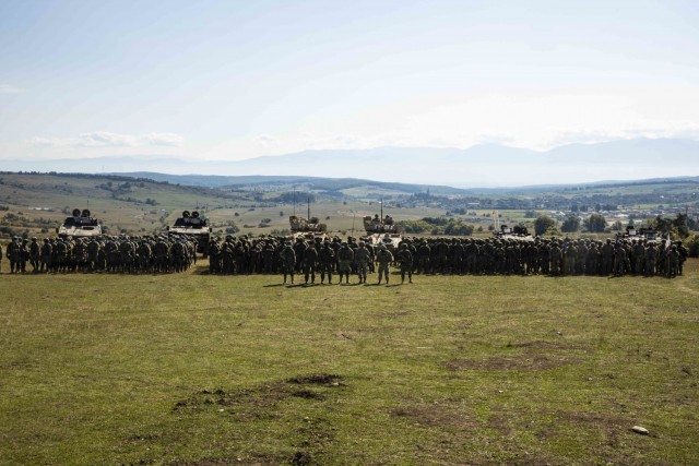 U.S. Army Soldiers assigned to 1st Battalion, 16th Infantry Regiment “Iron Rangers,” 1st Armored Brigade Combat Team, 1st Infantry Division pose for a photo with NATO allies from Romania, Poland and Portugal  in Cincu, Romania, Sept. 27, 2021....