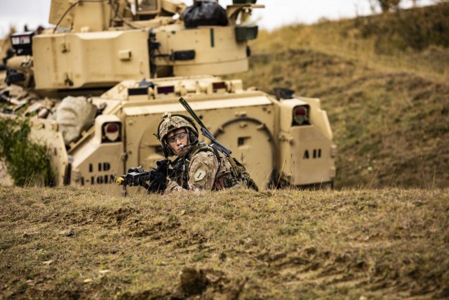 U.S. Army Sgt. Benjamin Koger, Alpha Company, 1st Battalion, 16th Infantry Regiment “Iron Rangers,” 1st Armored Brigade Combat Team, 1st Infantry Division pulls security during a multinational situational training exercise in Cincu, Romania,...