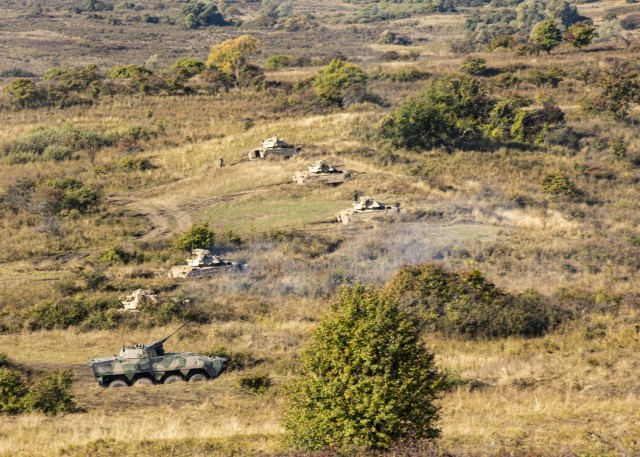 U.S. Army Soldiers assigned to 1st Battalion, 16th Infantry Regiment “Iron Rangers,” 1st Armored Brigade Combat Team, 1st Infantry Division execute a multinational live-fire exercise with NATO allies from Romania, Poland and Portugal  in...