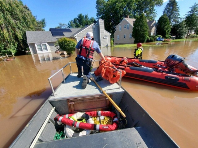 Firefighters with the Picatinny Arsenal Fire Department conduct water rescue operations in the wake 