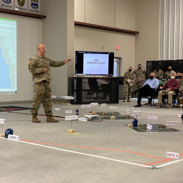 Maj. Clint Brooks, 188th Infantry Brigade chief of operations, briefs installation leadership and staff during a tabletop exercise to rehearse cohort movement for the National Guard southwest border demobilization taking place on Fort Stewart October through November; local Soldiers and families can expect to see impacts with services, especially medical, on post during the demobilization.