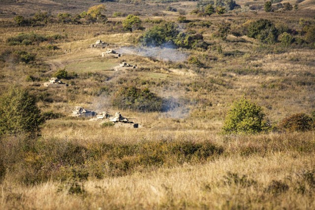 U.S. Army Soldiers assigned to 1st Battalion, 16th Infantry Regiment “Iron Rangers,” 1st Armored Brigade Combat Team, 1st Infantry Division execute a multinational live-fire exercise with NATO allies from Romania, Poland and Portugal  in...