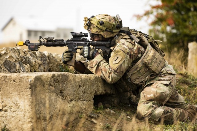 U.S. Army Spc. Daron Hutson, Alpha Company, 1st Battalion, 16th Infantry Regiment “Iron Rangers,” 1st Armored Brigade Combat Team, 1st Infantry Division, pulls security during a multinational situational training exercise in Cincu, Romania,...