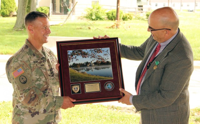 Col. Bailey presents gift