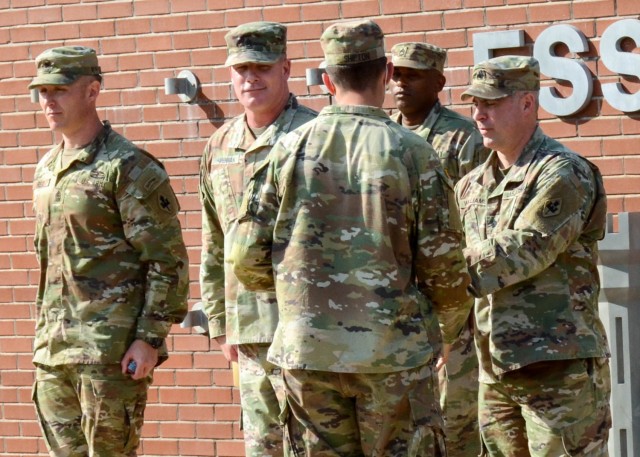 Counter Explosives Hazard Center Director Lt. Col. Aaron Williams presents Spc. Austin Shipton with the North Carolina National Guard a certificate Sept. 24 at Sapper Grove, for completion of the final iteration of the Route Reconnaissance Clearance Course. 