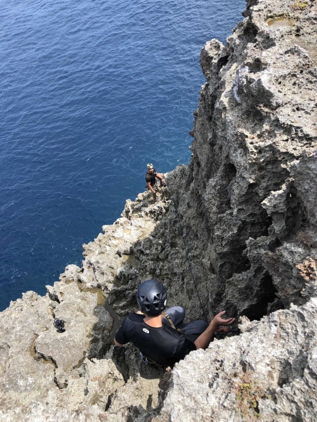 OKINAWA, Japan - U.S. Army Green Berets with 1st Battalion, 1st Special Forces Group (Airborne) climb an ocean side rock face during the Basic Military Mountaineering Course held Sept. 7-16, 2021.  During the course, Soldiers develop skills ranging from tying basic knots to practicing Tyrolean traverse methods throughout varying terrain and obstacles. (U.S. Army Courtesy Photo)