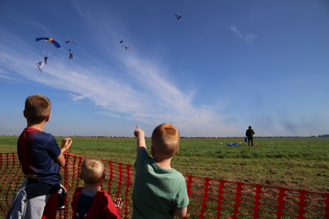Spectators watch Belgian paratroopers land on Chièvres Air Field. Chièvres Air Fest took place Sept. 25, 2021 at Chièvres Air Base, Belgium. The Saturday event was the first time the base was opened to the general public in more than 25 years....