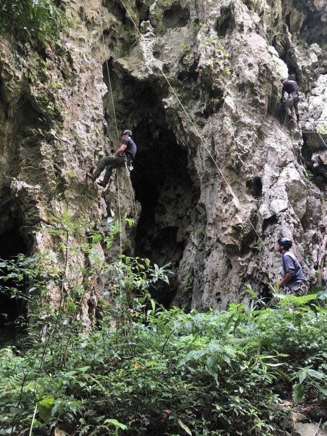 OKINAWA, Japan - U.S. Army Green Berets with 1st Battalion, 1st Special Forces Group (Airborne) ascend a cave wall during the Basic Military Mountaineering Course held Sept. 7-16, 2021.  During the course, Soldiers develop skills ranging from tying basic knots to practicing Tyrolean traverse methods throughout varying terrain and obstacles. (U.S. Army Courtesy Photo)