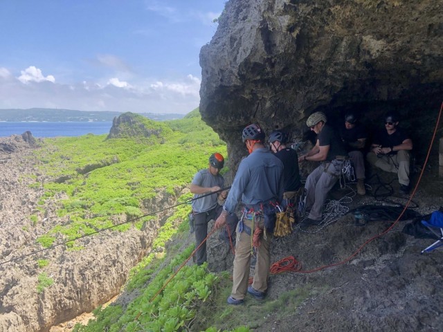 OKINAWA, Japan - U.S. Army Green Berets with 1st Battalion, 1st Special Forces Group (Airborne) prepare an anchor for a Tyrolean rope bridge the Basic Military Mountaineering Course held Sept. 7-16, 2021.  During the course, Soldiers develop...