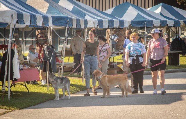 Patrons and their pets peruse the flea market tents at the Pawesome Flea Market Sept, 18, 2021 at the Solomon Center at Fort Jackson, S.C.
