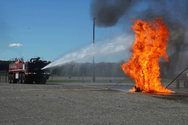 Middle Tennessee firefighters battle a simulated aircraft fuel spill fire using a turret during an International Fire Service Accreditation Congress Airport Firefighter course hosted Sept. 20-24 at Fort Campbell. Fort Campbell Fire and Emergency Services partnered with the Tennessee State Fire Commission to help approximately 14 firefighters earn their Airport Firefighter certification through the 40-hour program, which included classroom instruction and hands-on training.