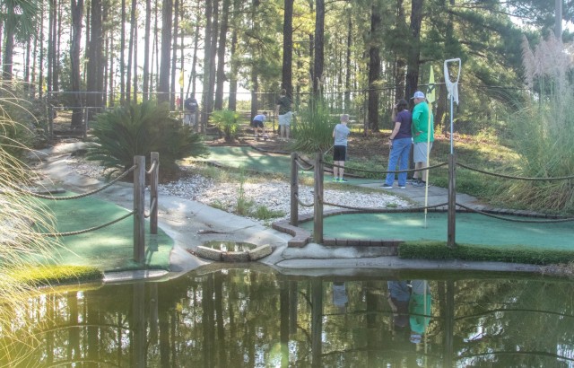 Families enjoyed a round of mini golf, free of charge, at Palmetto Mini Golf during the Pawesome Flea Market Sept. 18, 2021 at the Solomon Center, Fort Jackson, S.C. Jackson Geiser tees off during a mini golf game with his Family while enjoying...