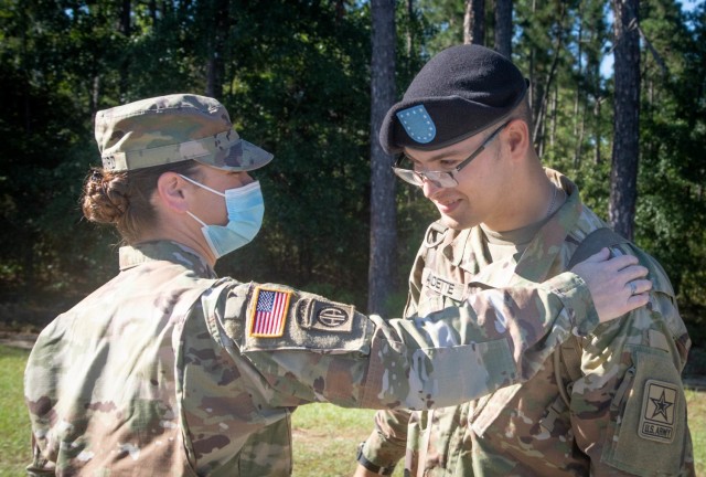 Staff Sgt. Leah J. Bickford, left, congratulates her son Pvt. Jayden Audette, right, after his Basic Combat Training graduation Sept. 23, 2021, at Fort Jackson, S.C. The mother and son duo are both members of the Maine Army National Guard and...