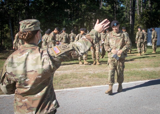 Staff Sgt. Leah J. Bickford, left, gets ready to hug her son Pvt. Jayden Audette, right, after his Basic Combat Training graduation Sept. 23, 2021 at Fort Jackson, S.C. The mother and son duo are both members of the Maine Army National Guard and...