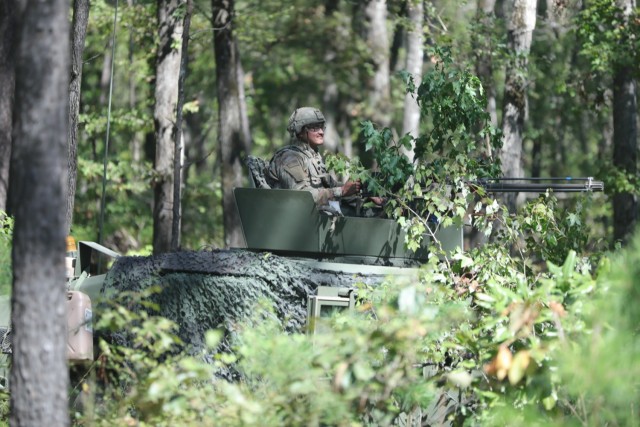 A Soldier from Apache Troop, 1-33 Calvary, 3rd Battalion Combat Team, 101st Airborne Division (Air Assault) conducts road security while in cover at the Joint Readiness Training Center (JRTC) in Fort Polk, LA. JRTC focuses on improving unit readiness by providing realistic, stressful, joint, and combined arms training.