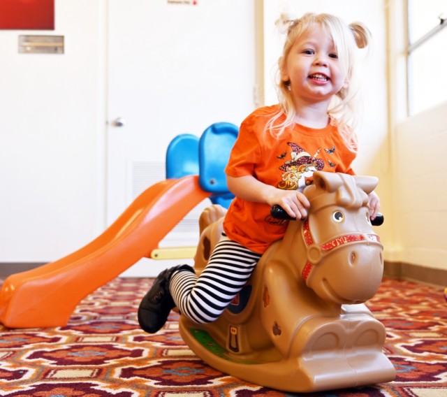 Rosie Hardin, 2, plays on a rocking horse during the weekly playgroup at Army Community Service, Ord Military Community, Calif., Sept. 28.
