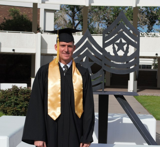 Command Sgt. Maj. Jeffery Grela stands in front of the U.S. Army Sergeants Major Academy, Fort Bliss, Texas, in 2015. He also received his Masters of Business Administration from Trident University while attending the academy. Grela transferred into the military's newest branch of service  - the Space Force - on Oct. 1. (Courtesy photo by Command Sgt. Major Jeffery Grela/RELEASED)