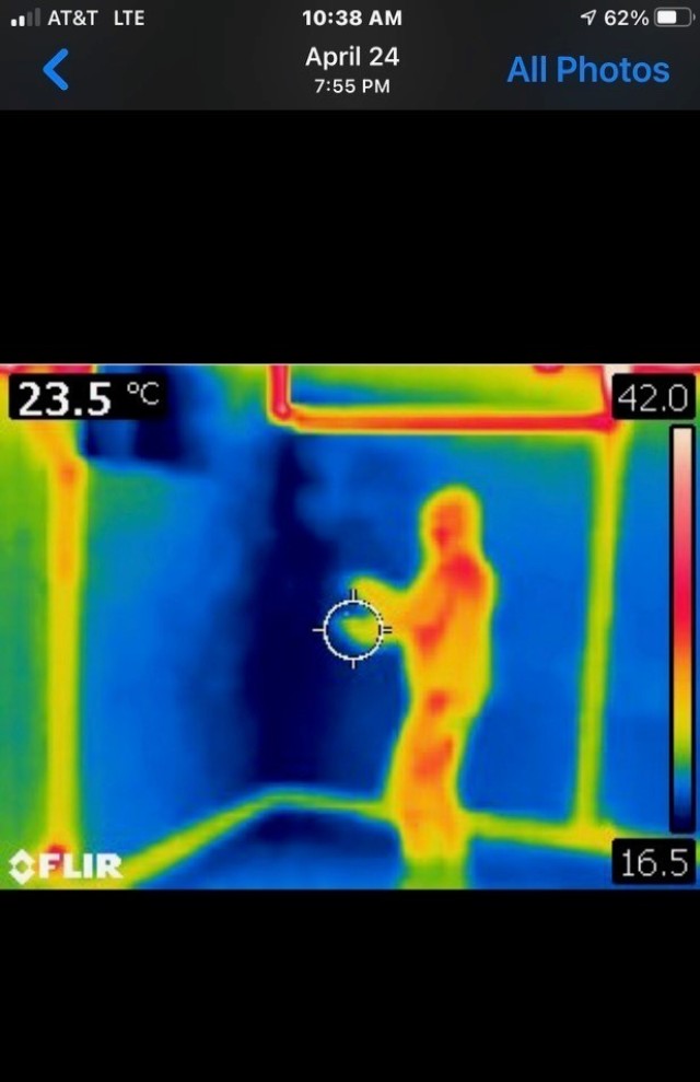 A screenshot of an infrared thermal imaging camera used by the Illinois Paranormal Research Group show the difference between a living being (red and yellow outline) and a spirit form (dark blue/violet). (Photo by Illinois Paranormal Research Group)