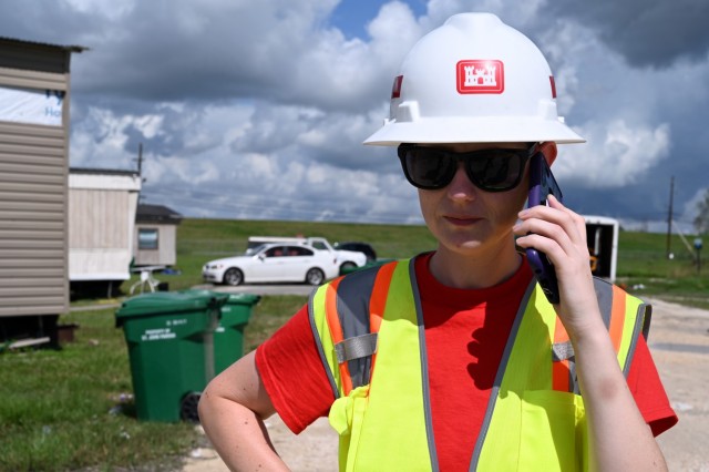 Brittanie Corley, U.S. Army Corps of Engineers, New Orleans District, economist currently deployed to New Orleans, Louisiana, in support of Hurricane Ida recovery efforts, talks with a property manager during a site inspection in Edgard,...