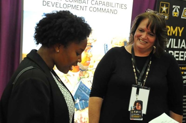 A DEVCOM recruiter (right) helps a prospective candidate during a recent WOC STEM conference. This year’s conference will be held virtually October 7-9, 2021.