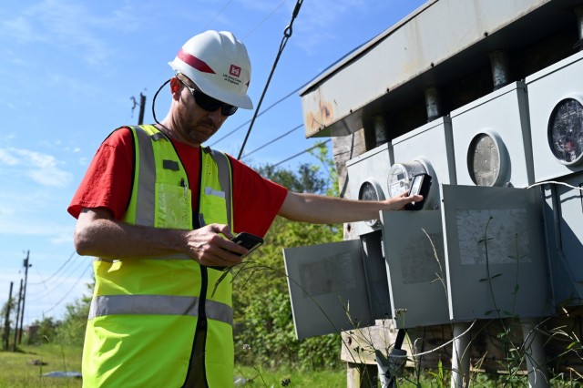 Matt Clark, U.S. Army Corps of Engineers, St. Paul District, project scheduler currently deployed to New Orleans, Louisiana, in support of Hurricane Ida recovery efforts, gathers technical data during a site inspection in Edgard, Louisiana, Oct....