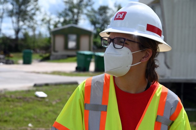 Helen Walz, U.S. Army Corps of Engineers, St. Paul District, civil engineer currently deployed to New Orleans, Louisiana, in support of Hurricane Ida recovery efforts, looks at infrastructure during a site inspection in Edgard, Louisiana, Oct. 3....