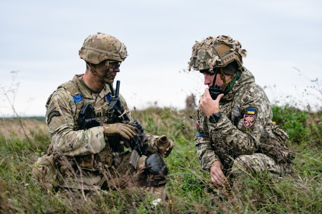 A U.S. Army paratrooper assigned to 1st Battalion, 503rd Parachute Infantry Regiment, 173d Airborne Brigade, coordinates the establishment of a joint security posture on a drop zone with a paratrooper from the Lithuanian - Polish - Ukrainian Brigade after conducting a joint airborne operation. This training is part of Exercise Rapid Trident 21 at the International Peacekeeping Security Centre near Yavoriv, Ukraine, Sept. 25, 2021.

Rapid Trident 21 involves approximately 6,000 personnel from 15 nations, Sept. 20 - Oct. 1, 2021. Rapid Trident is an annual, multinational exercise that supports joint combined interoperability among the partner militaries of Ukraine and the United States, as well as Partnership for Peace nations and NATO Allies.

The 173d Airborne Brigade is the U.S. Army&#39;s Contingency Response Force in Europe, providing rapidly deployable forces to the United States European, Africa and Central Command areas of responsibility. Forward deployed across Italy and Germany, the brigade routinely trains alongside NATO allies and partners to build partnerships and strengthen the alliance.

