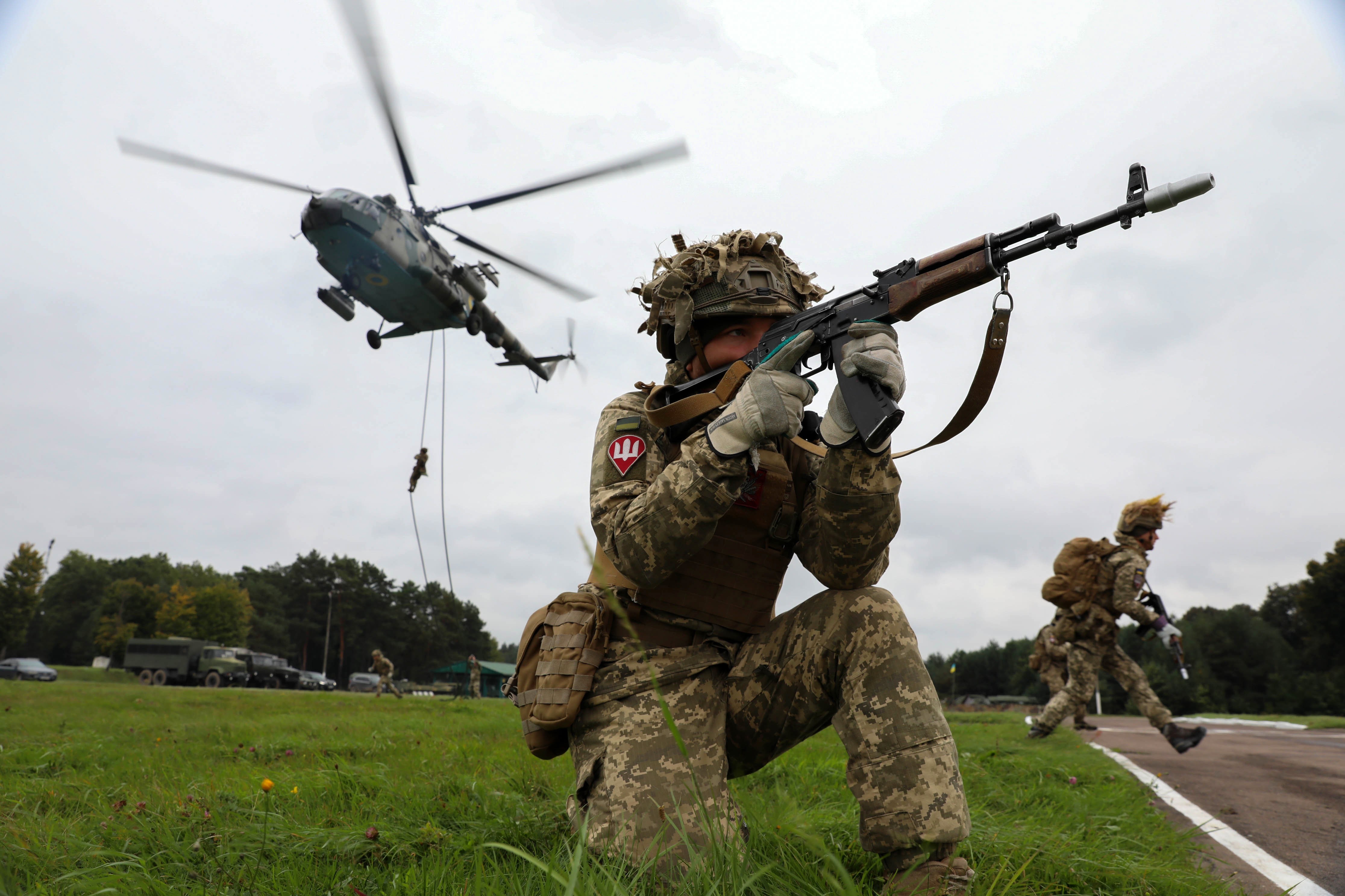 a large-scale military exercise of troops, warships, and other forces.