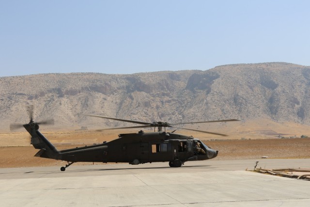 A UH-60 Black Hawk helicopter from C Company, 1st Assault Helicopter Battalion, 140th Aviation Regiment, lands in northern Iraq during a battlefield circulation. Command teams from Task Force Phoenix and Task Force Wolfpack were visiting with their Soldiers at remote locations.