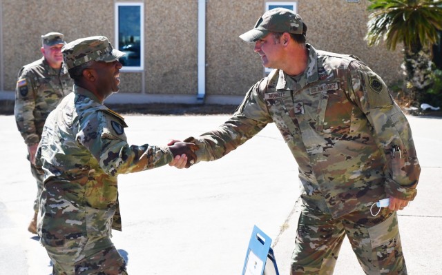 Brig. Gen Jason Kelly, USACE South Atlantic Division Commander, shakes hands with Col. Gregory Moseley, 325th Fighter Wing Commander during Kelly's visit to Tyndall Air Force Base, Fla. on Sep. 27, 2021. Kelly was visiting the base to get an...