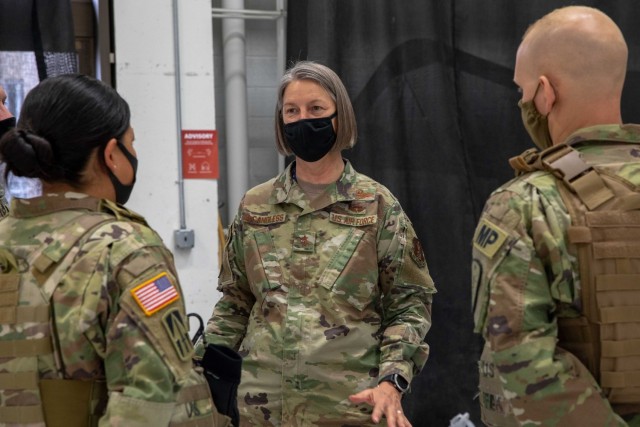 Air Force Maj. Gen. Sherrie McCandless, the D.C. National Guard commanding general, stands beside he