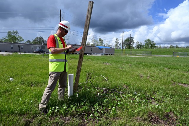 Matt Clark, U.S. Army Corps of Engineers, St. Paul District, project scheduler currently deployed to New Orleans, Louisiana, in support of Hurricane Ida recovery efforts, gathers technical data during a site inspection in Edgard, Louisiana, Oct....