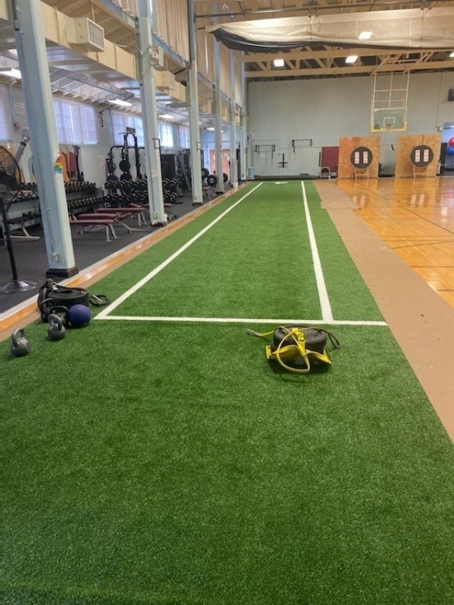 A turf lane can be seen inside the Keeler Gym at the Joint Base Lewis McChord Soldier Recovery Unit (SRU) in Washington state. (Photo via David Iuli)