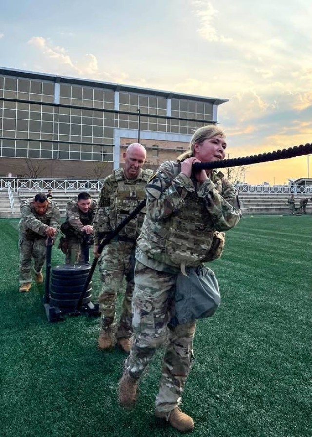 Col. W. Maria Bochat, the chief of staff for the 2nd Infantry Division, and other senior leaders participate in a specialized physical training session. Bochat is the first female chief of staff for the division. (U.S. Army photo by Lt. Col. Ryan Donald.)