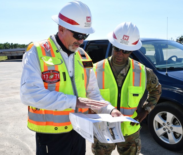 Brig. Gen. Jason Kelly, USACE South Atlantic Division Commander, right, looks at a construction map of the new Child Development Center currently being built at Tyndall Air Force Base, Fla. on Sep. 27, 2021. The USACE team at Tyndall is currently...