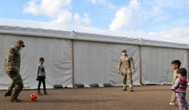 Security detail sometimes includes soccer practice with travelers at Rhine Ordnance Barracks in Kaiserslautern, Germany during Operation Allies Welcome. Joint Security forces include MPs and engineers from 18th MP Brigade as well as units from...